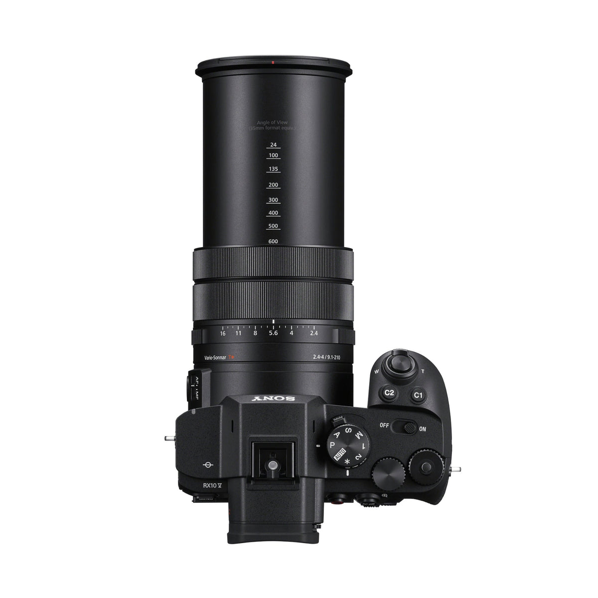 Sony RX10 V vista dall'alto con l'obiettivo esteso: la scala degli angoli di campo da 24 a 600 mm stampata sul barilotto, la ghiera dei diaframmi, la ghiera dei modi e la scritta RX10 V