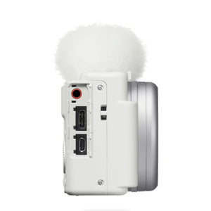 Lato della Sony ZV-1 II bianca con lo sportello aperto sugli ingressi microfono, USB-C e HDMI